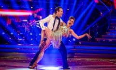 Katie Derham, in a gold sparkly dress, and Anton du Beke dancing