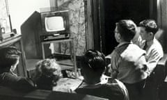 A family gather around a TV in 1951.