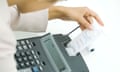 Businesswoman using adding machine