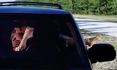 Couple kissing in a car