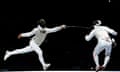 Italy's Andrea Baldini and Kenta Chida of Japan contest the men's foil team fencing gold medal