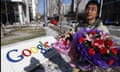 A Chinese Google user with a bouquet of flowers at the Google China headquarters in Beijing