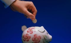 Putting coins in a piggy bank