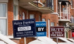 Estate agents for sale signs on beach front properties in Littlehampton, West Sussex