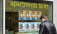 A man looks in the window of a Manchester estate agent