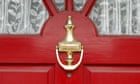 A traditional house front door and knocker