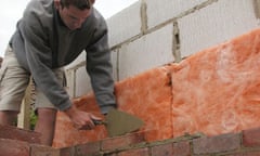 builder laying bricks