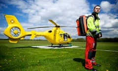 air ambulance paramedic David Fletcher stands in front of his helicopter at Manchester airport