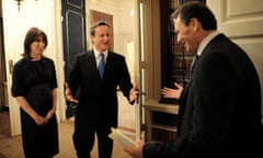 Britain's incoming Prime Minister Cameron and his wife Samantha enter 10 Downing Street in London