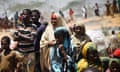 Somalian refugees from the al-Shabaab-controlled town of Afgooye make camp on the side of a road