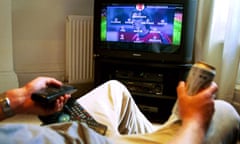 A man watching football on television 