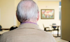 An elderly man sitting in a chair