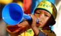 A young South African fan plays a vuvuzela