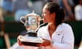 Li Na of China poses with the trophy after winning the French Open in Paris