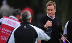 Ian Poulter of Great Britain and Ireland, right, celebrates with the team captain Paul McGinley