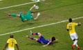 Jackson Martinez scores Colombia's second goal past Japan's goalkeeper Eiji Kawashima in the Group C