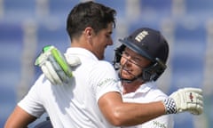 England's Alastair Cook is embraced by his team-mate Ian Bell during the Test against Pakistan