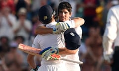 England captain Alastair Cook is congratulated by Jos Buttler after reaching his century on the firs