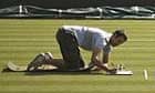 Groundsman checks grass length at Wimbledon