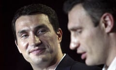 Heavyweight boxer Wladimir Klitschko with his brother Vitali address the media in Kiev