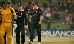 England captain Andrew Strauss leaves the field as moths halt play