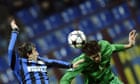 Inter Milan's Diego Milito, left, and Rubin Kazan defender Cesar Navas go up for a header