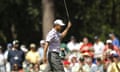 Tiger Woods acknowledges the crowd after sinking a putt on day three of the Masters