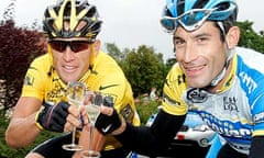 Lance Armstrong and team-mate George Hincapie toast the Texan's 2005 Tour de France win