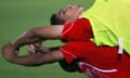 Equatorial Guinea's Juvenal Edjogo and José Bokung do some stretching