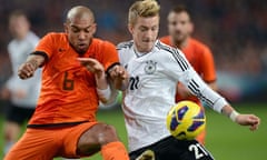 Germany's Marco Reus and Holland's Nigel de Jong fight for the ball in Amsterdam