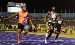 Yohan Blake (L) and Usain Bolt (front R) 