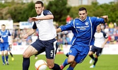 Peterhead's Scott Ross, right, challenges Lee Wallace of Rangers for possession