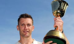 Warwickshire captain Jim Troughton celebrates with the county championship trophy