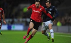 Wayne Rooney, right, kicks out at Jordon Mutch during Manchester United's 2-2 draw at Cardiff