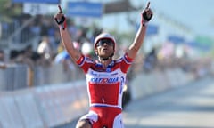 Italy's Luca Paolini crosses the finish line to win the third stage of the Giro d'Italia.