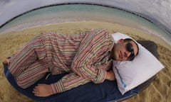 Jonathan Thompson asleep on beach