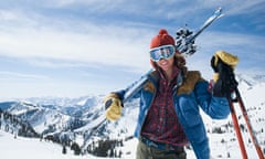 Woman holding skis on shoulder