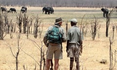 Dave Carson (left) and fellow guide Felix watching elephants at Camp Hwange