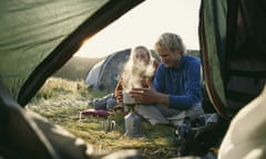 Couple outside tent, camping