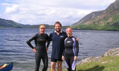 Brad Anderson, centre, of Swimtrek with two of his guests