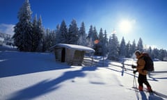 A hiker walking on snow