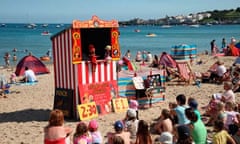 A Punch and Judy show on Swanage beach, Dorset.