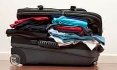 Suitcase stuffed with clothes