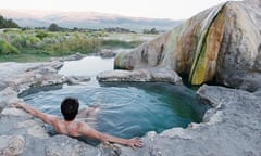 A woman sits alone in Travertine Hot Spring