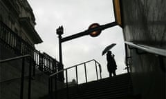 A commuter leaves the Underground tube station at Piccadilly Circus