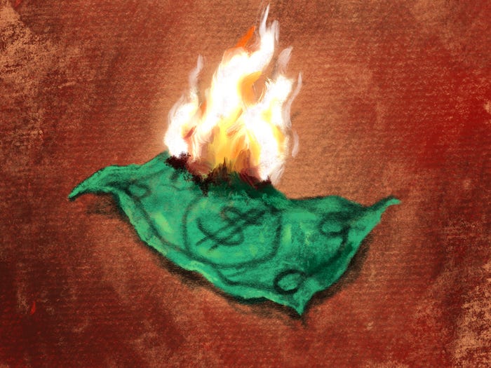 A lone dollar bill is catching on fire amid a brown background