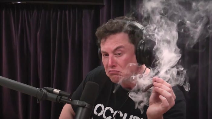 Elon Musk holding a spliff he just smoked