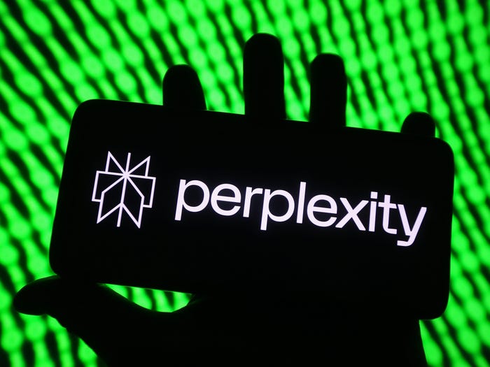 A photo illustration shows the Perplexity logo on a mobile phone.