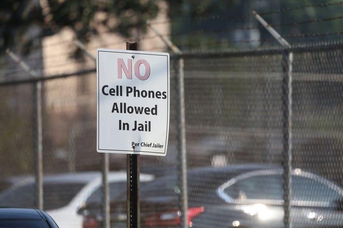 A sign that reads "NO Cell Phones Allowed In Jail" outside the Fulton County jail in Georgia.