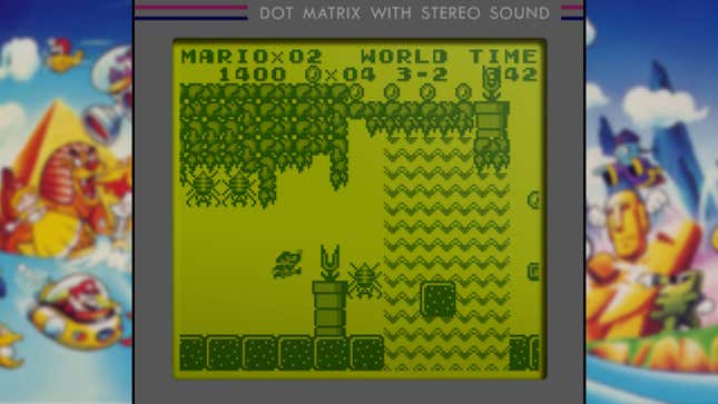 A Game Boy screen displays Mario jumping through a spider tunnel. 